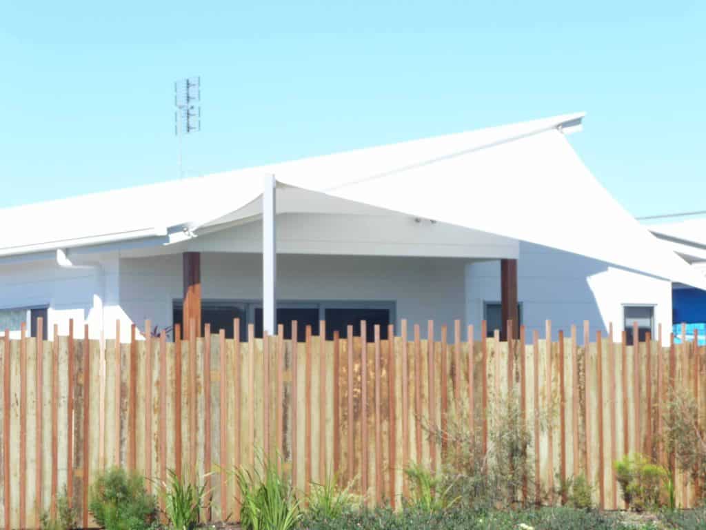 White shade zail attached to white house — Benefits of Shade Sails in Buderim, QLD