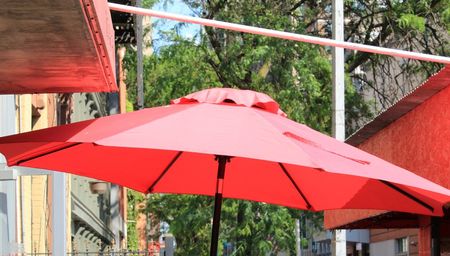 Red umbrella in the backyard — Outdoor Blinds  in Buderim, QLD