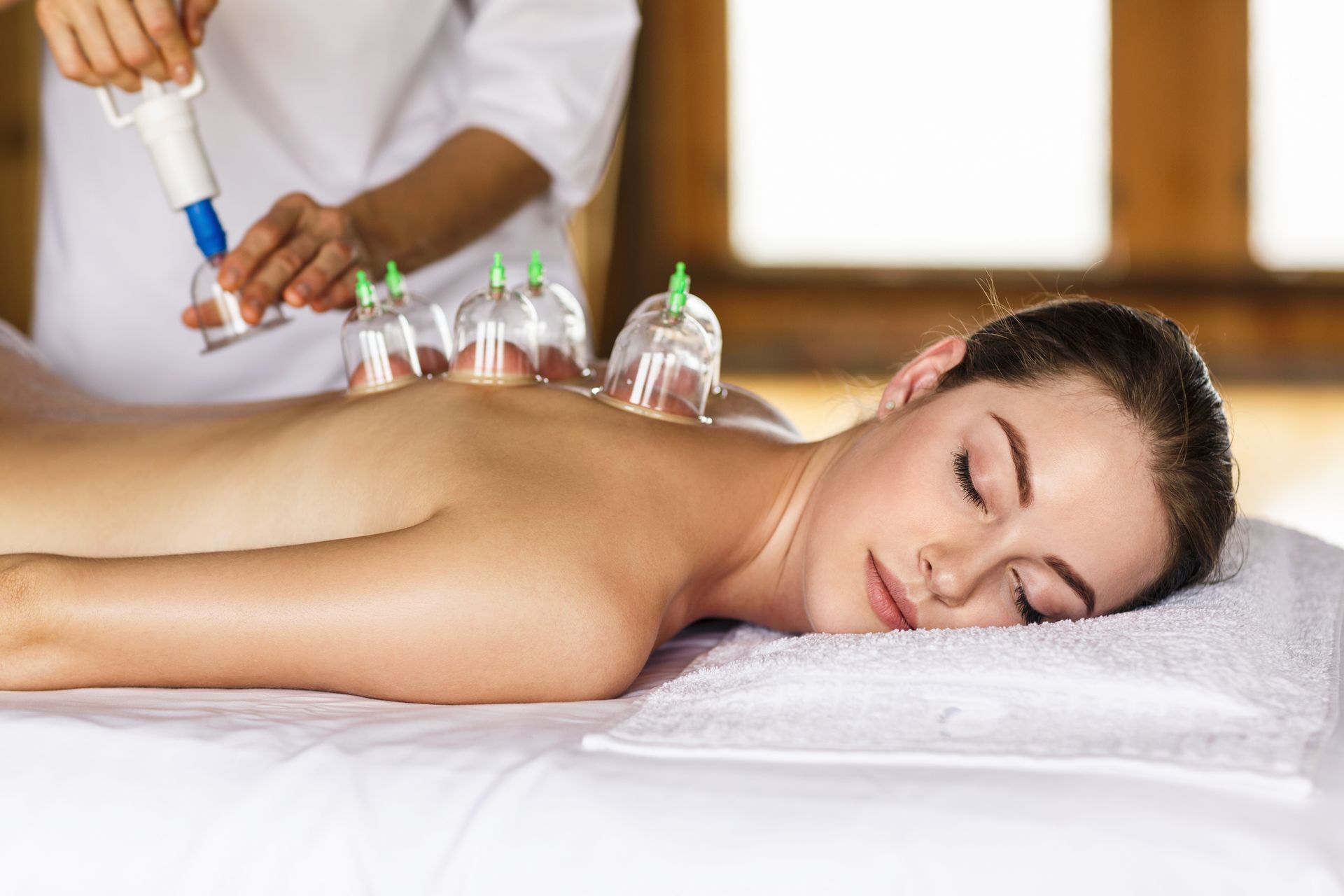 Woman During Cupping Therapy — Massage Therapy in Kirwan, QLD