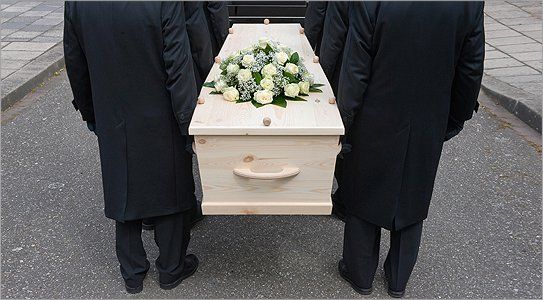 Pall bearers carrying a coffin