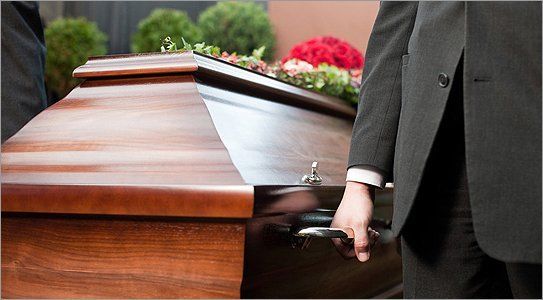 Pall bearers carrying a coffin