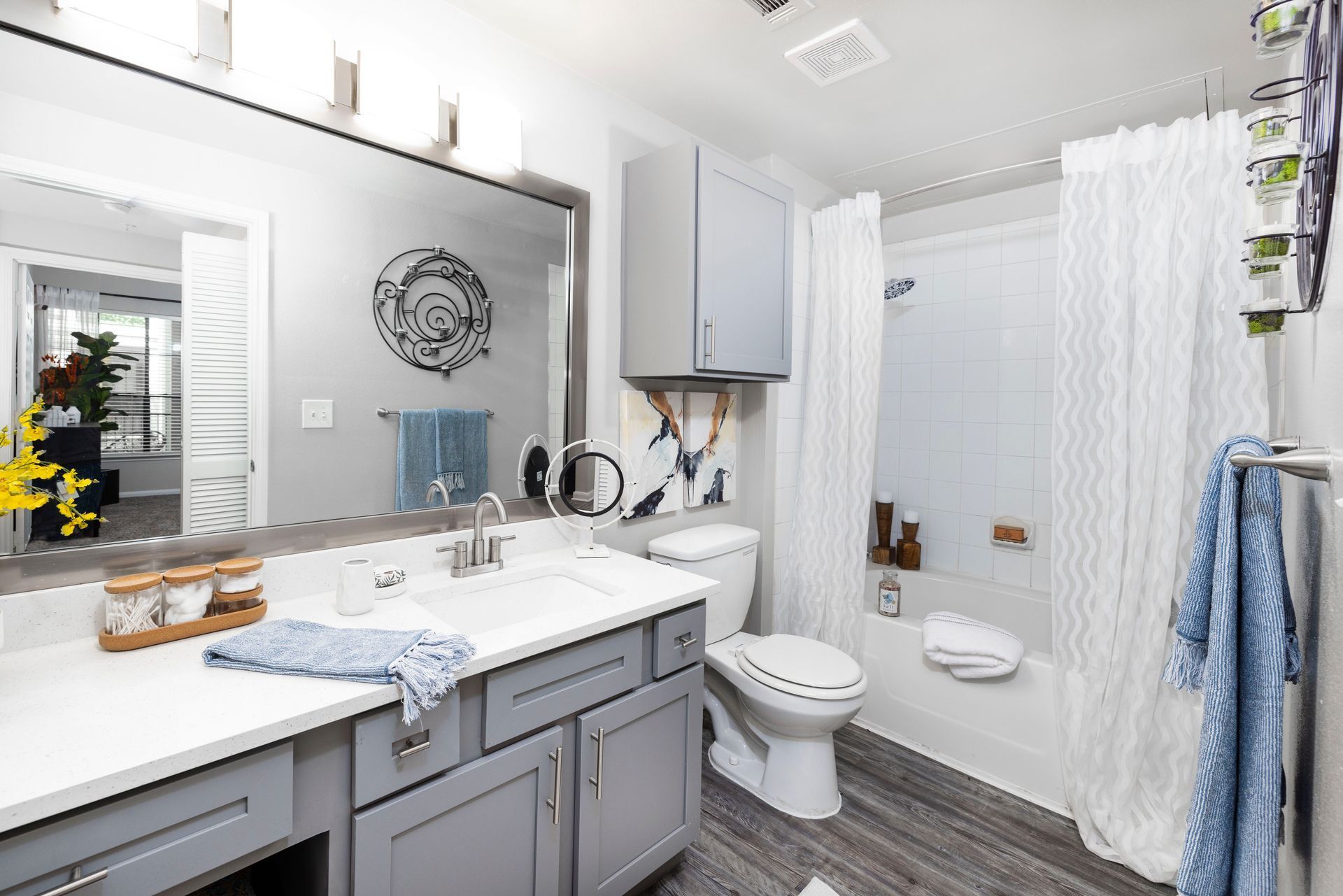 A bathroom with a toilet , sink , and shower.