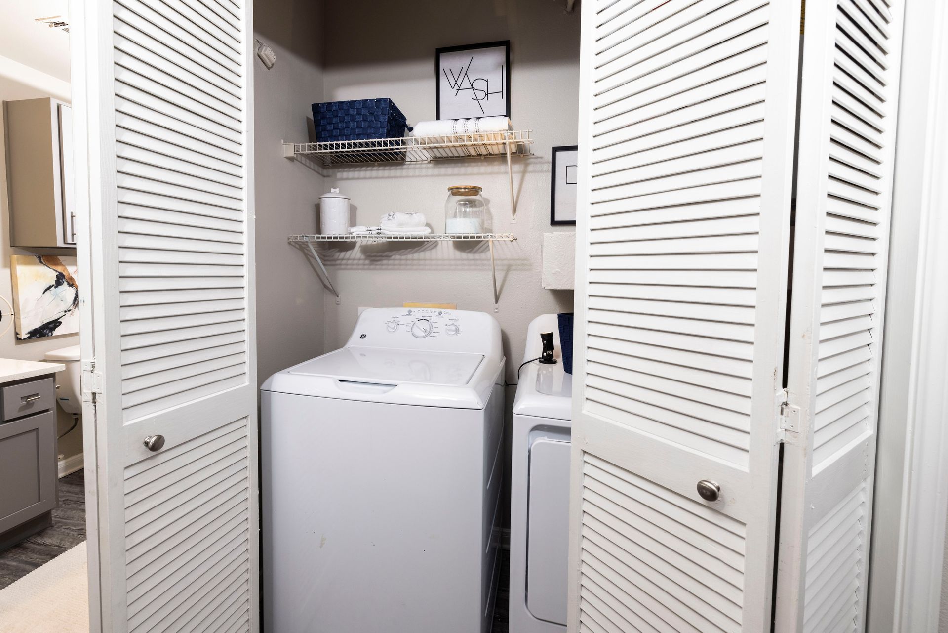 A laundry room with a washer and dryer in it.