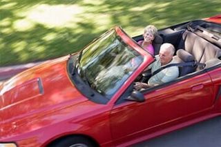 Couple Driving In Red Convertible - Transmission service and repair in Medford, Oregon