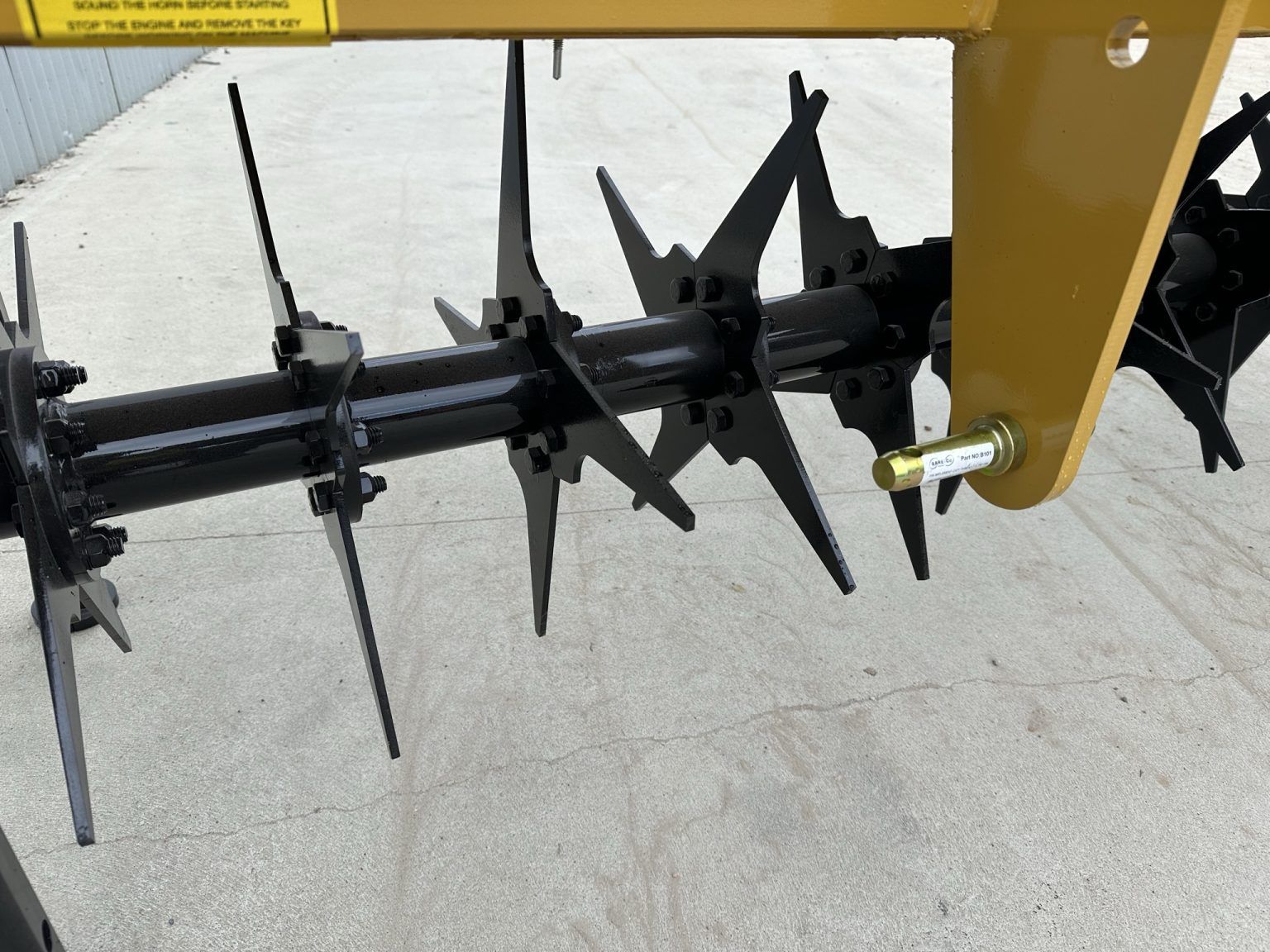 A close up of a machine on a concrete surface.