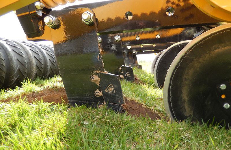 A close up of a piece of equipment in the grass
