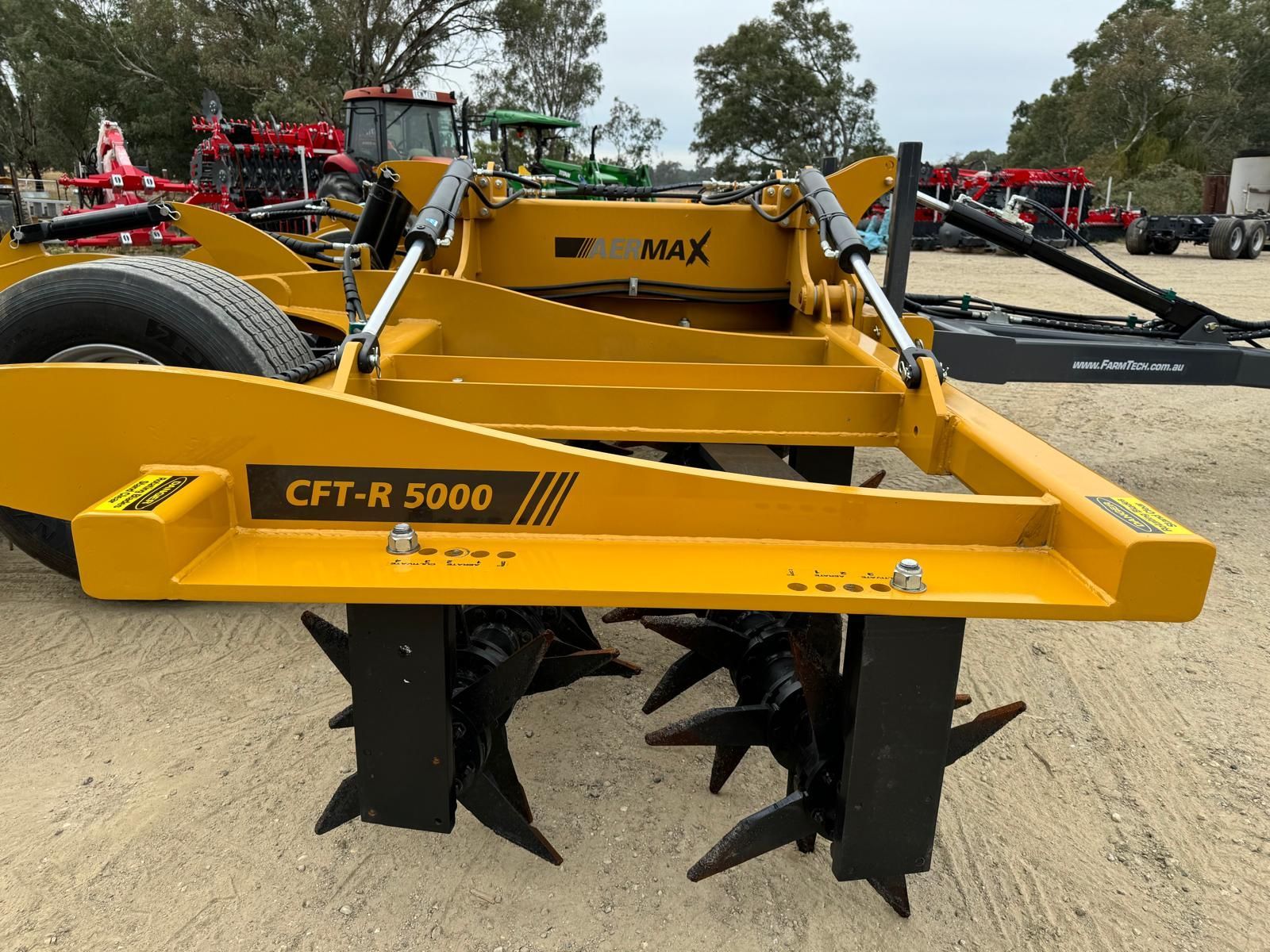 A close up of a machine with a lot of blades on it in a field.