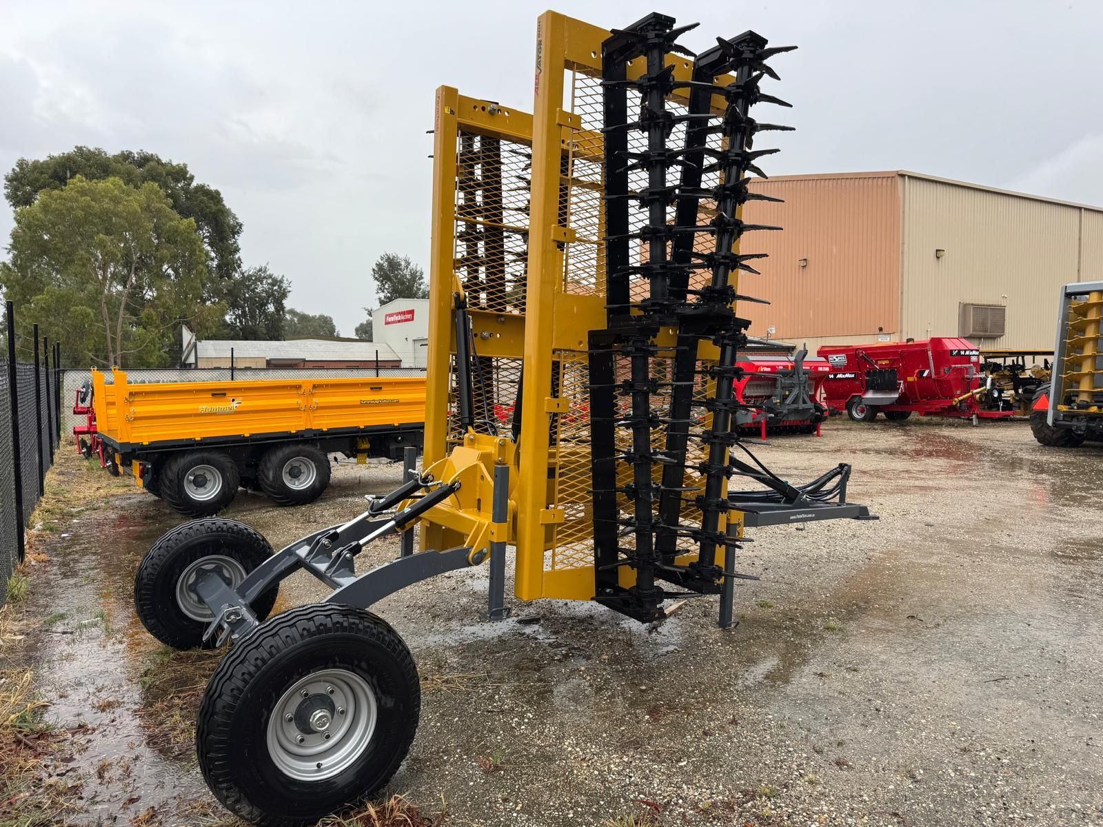 A close up of a machine with a lot of blades on it in a field.