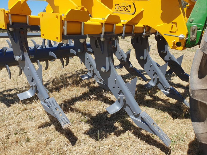 A yellow and gray machine with the word excel on it