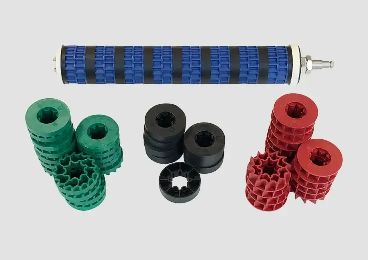 A bunch of seed rollers are stacked on top of each other on a white surface.