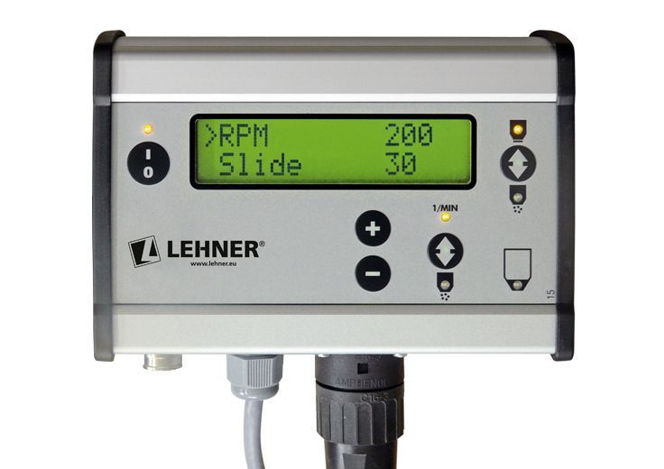 A lehner device has a green screen that says rpm slide