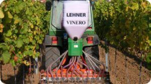 A lehner vinero tractor is working in a vineyard