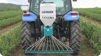 A lehner vinero tractor is driving through a field