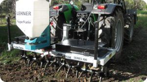 A tractor with a machine attached to it that says lerner