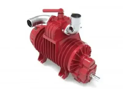 A red vacuum pump is sitting on a white surface.