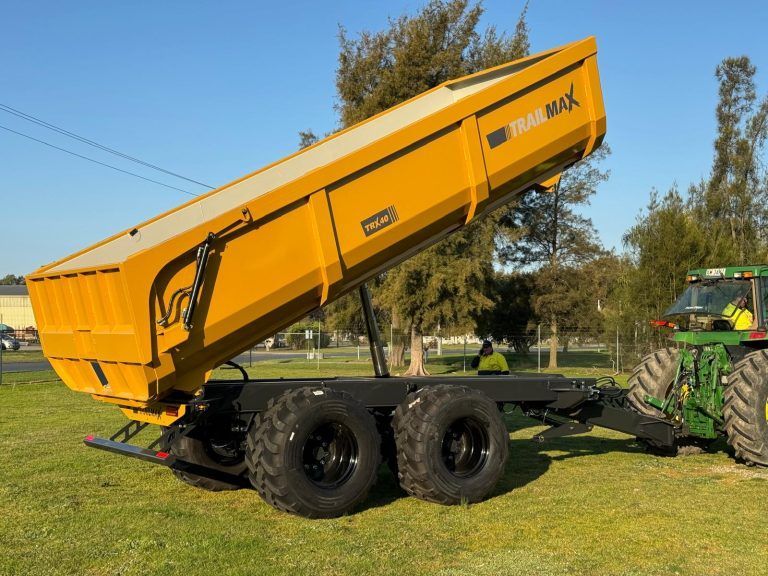 A yellow silage trailer with the word max on it