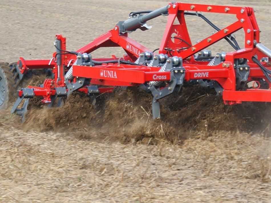 A red and black machine with the word cross on it