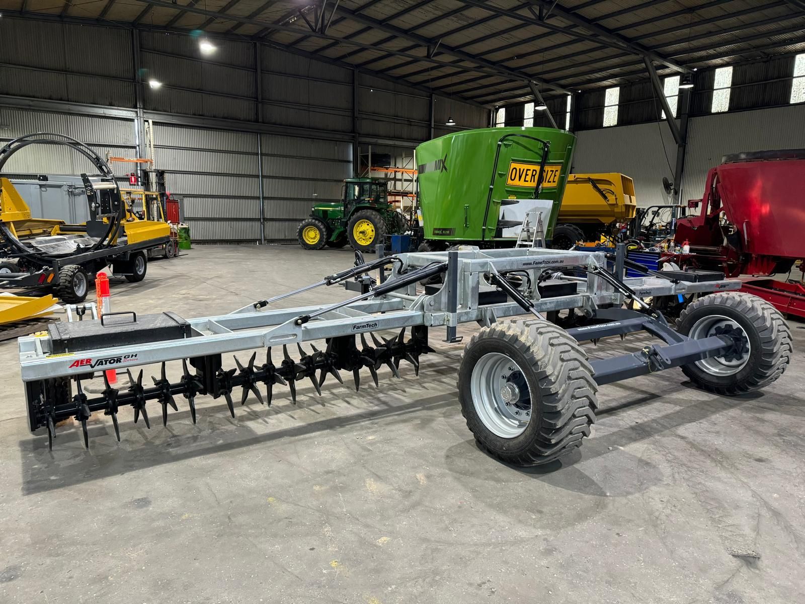 A tractor with a farmtech aerator attached to it