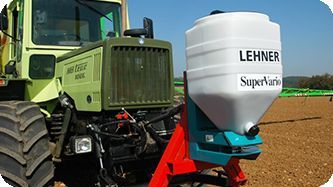 A row of conserve pak tractors are lined up in a field