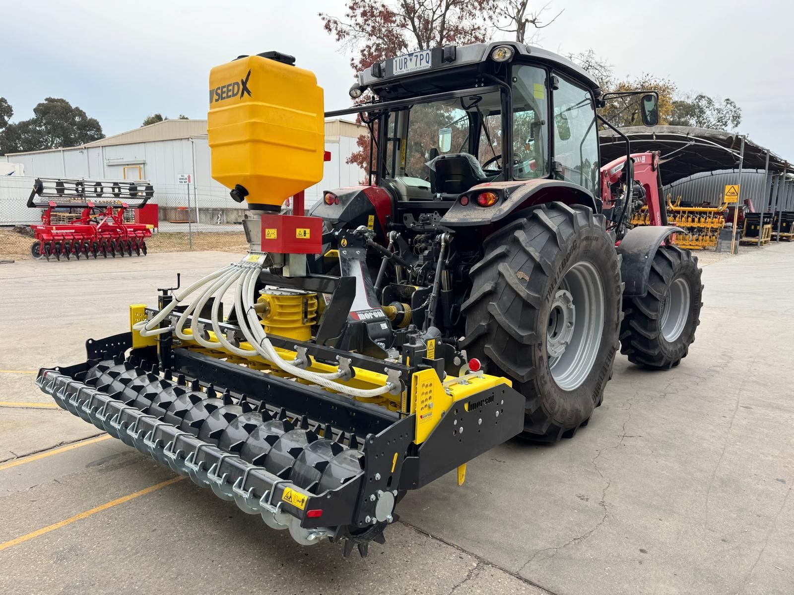 A yellow and black machine is sitting on a white surface.