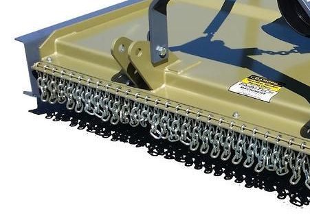 A close up of a lawn mower on a white background