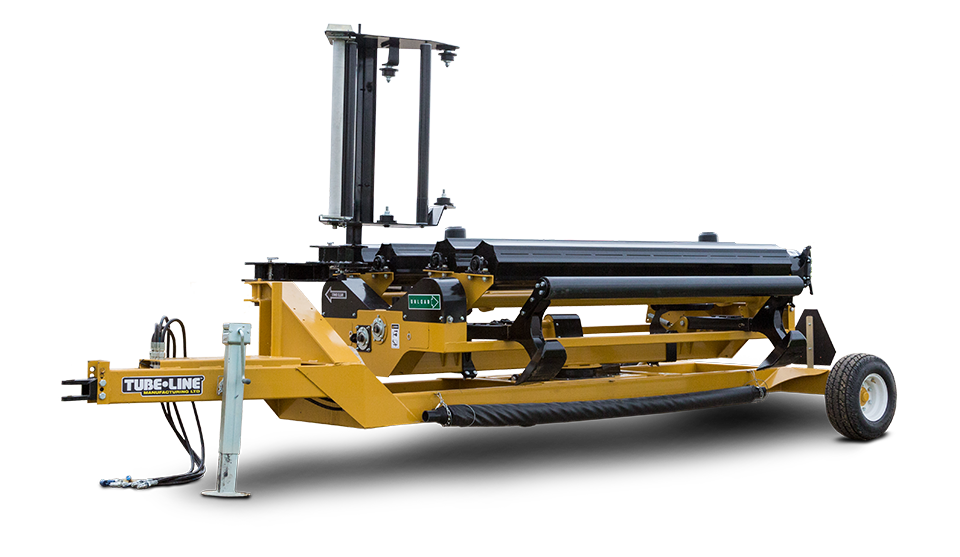 A yellow and black machine is sitting on a trailer on a white background.