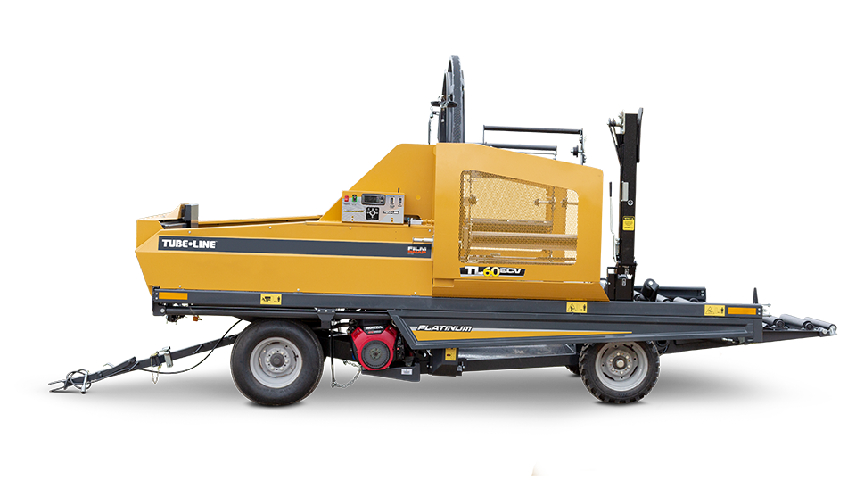 A yellow and black machine on a trailer on a white background.