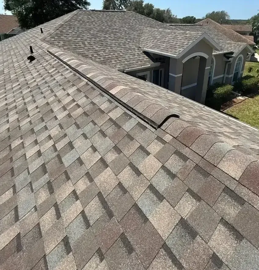 A close up of a roof of a house with shingles on it.