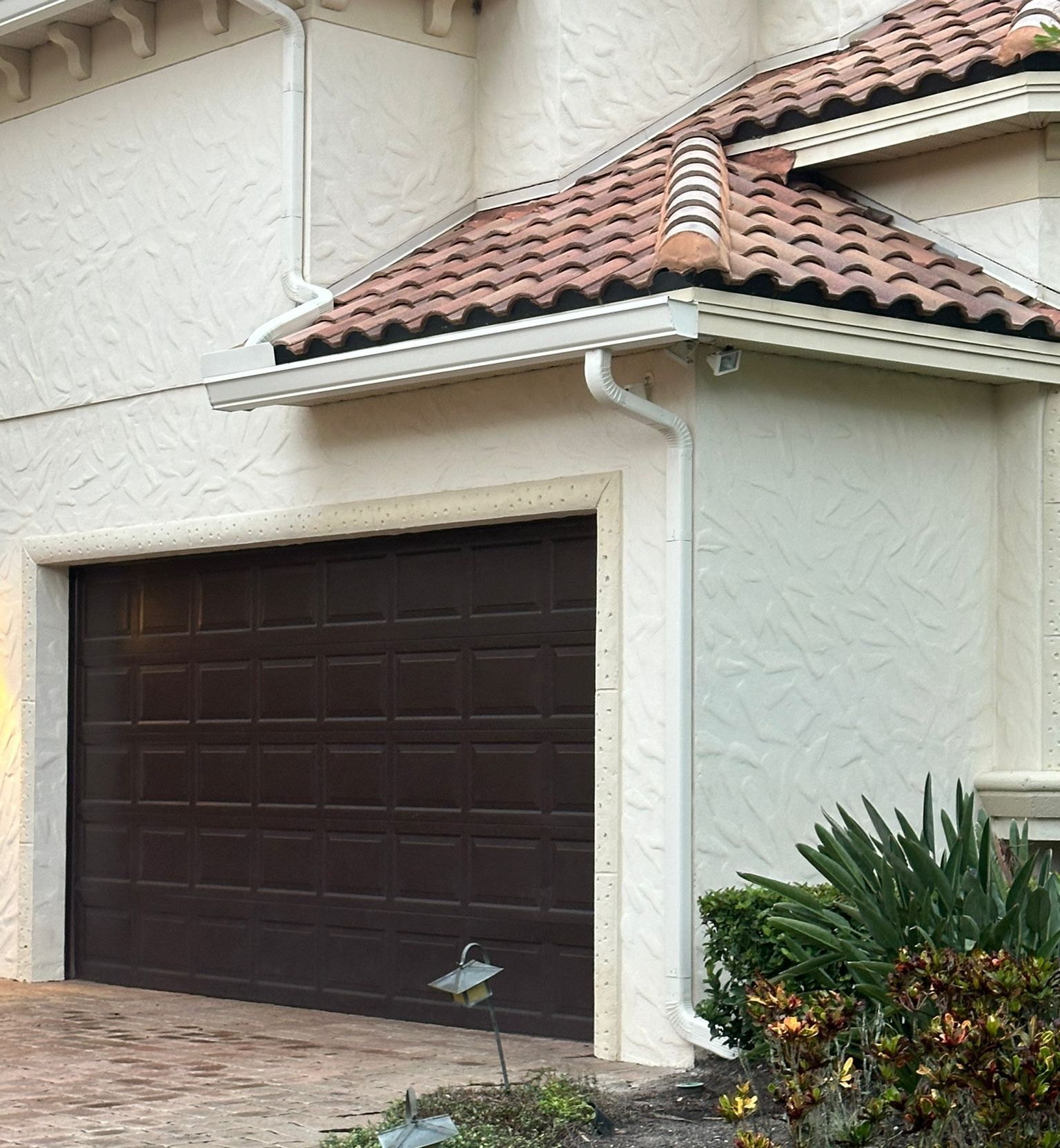 A close up of a roof with a gutter guard on it.