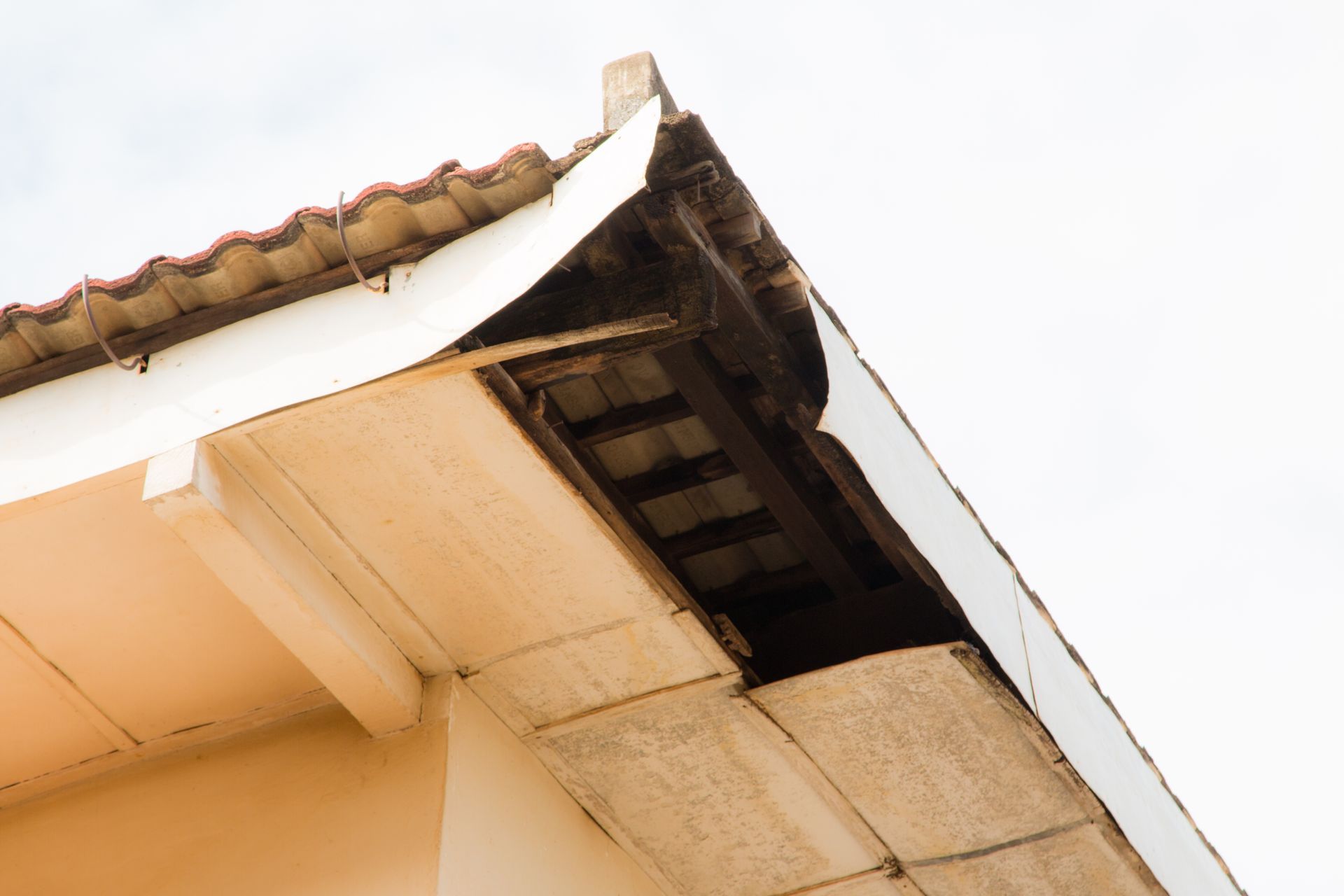 A close up of the roof of a building with a hole in it.