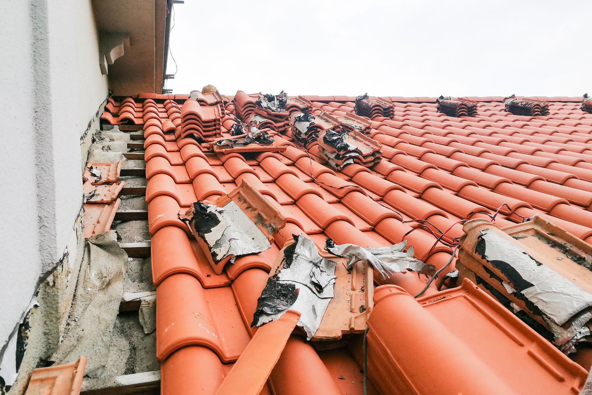 A roof with broken roof tiles