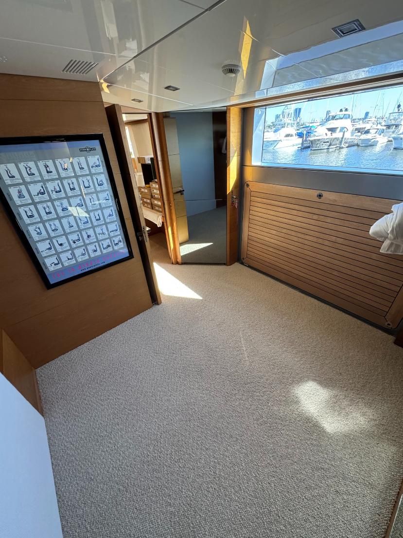 Vacuum Cleaner Cleaning a Grey Carpet — Gold Coast Carpet Cleaning Service in Surfers Paradise, QLD