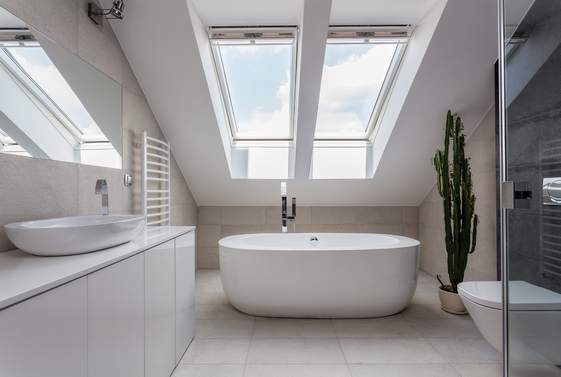 beautiful minimalistic bathroom with a natural skylight