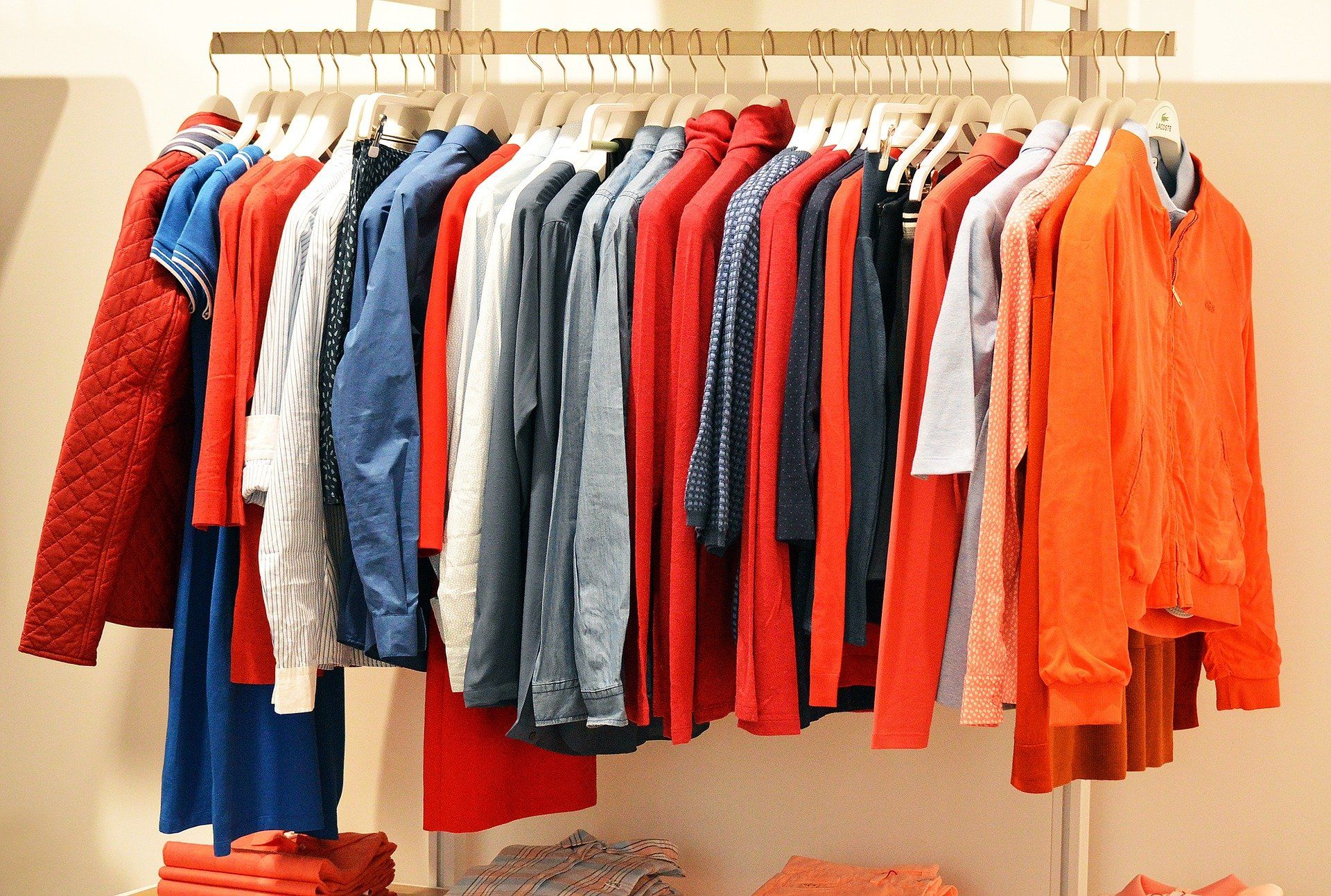 rack of colorful hanging clothes