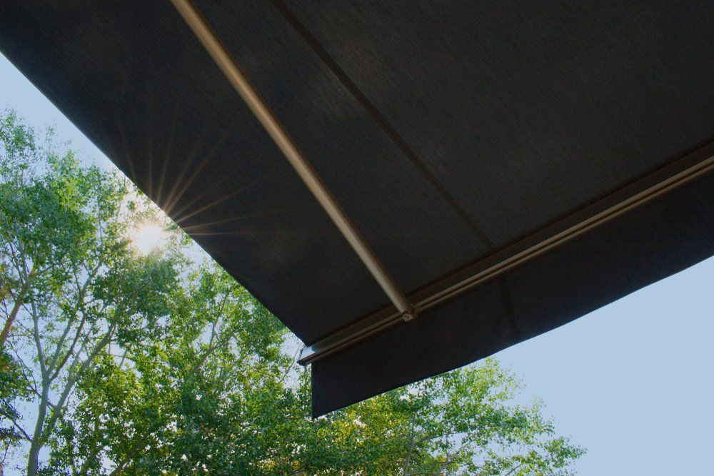 A fabric awning extended over a patio