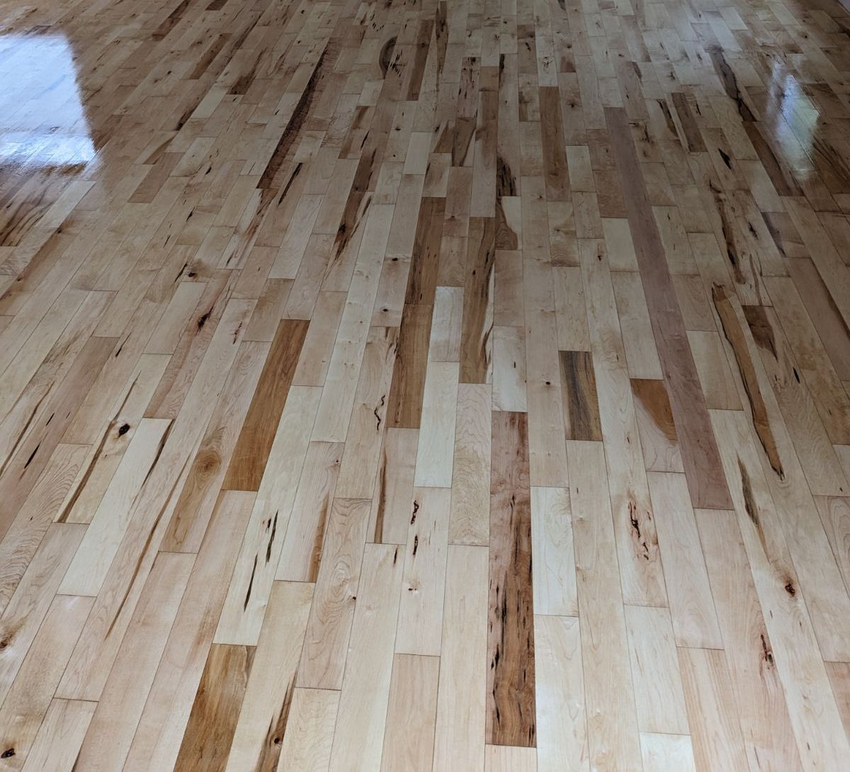 A close up of a wooden floor in a room