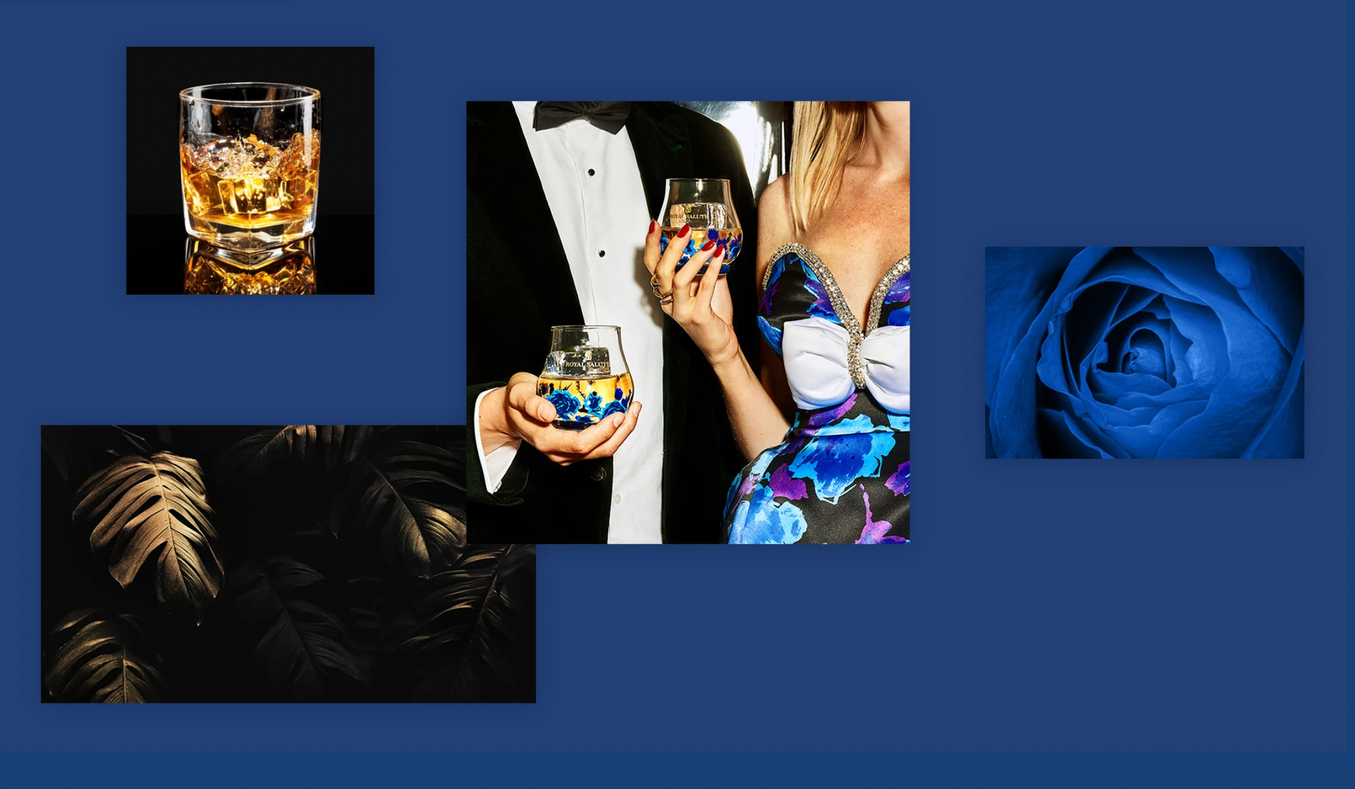 Arrangement with glasses of whiskey, a blue rose, tuxedo, and tropical foliage on a blue background.