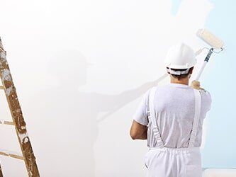 House Painting Services — Painter man at work in Bakersfield, CA