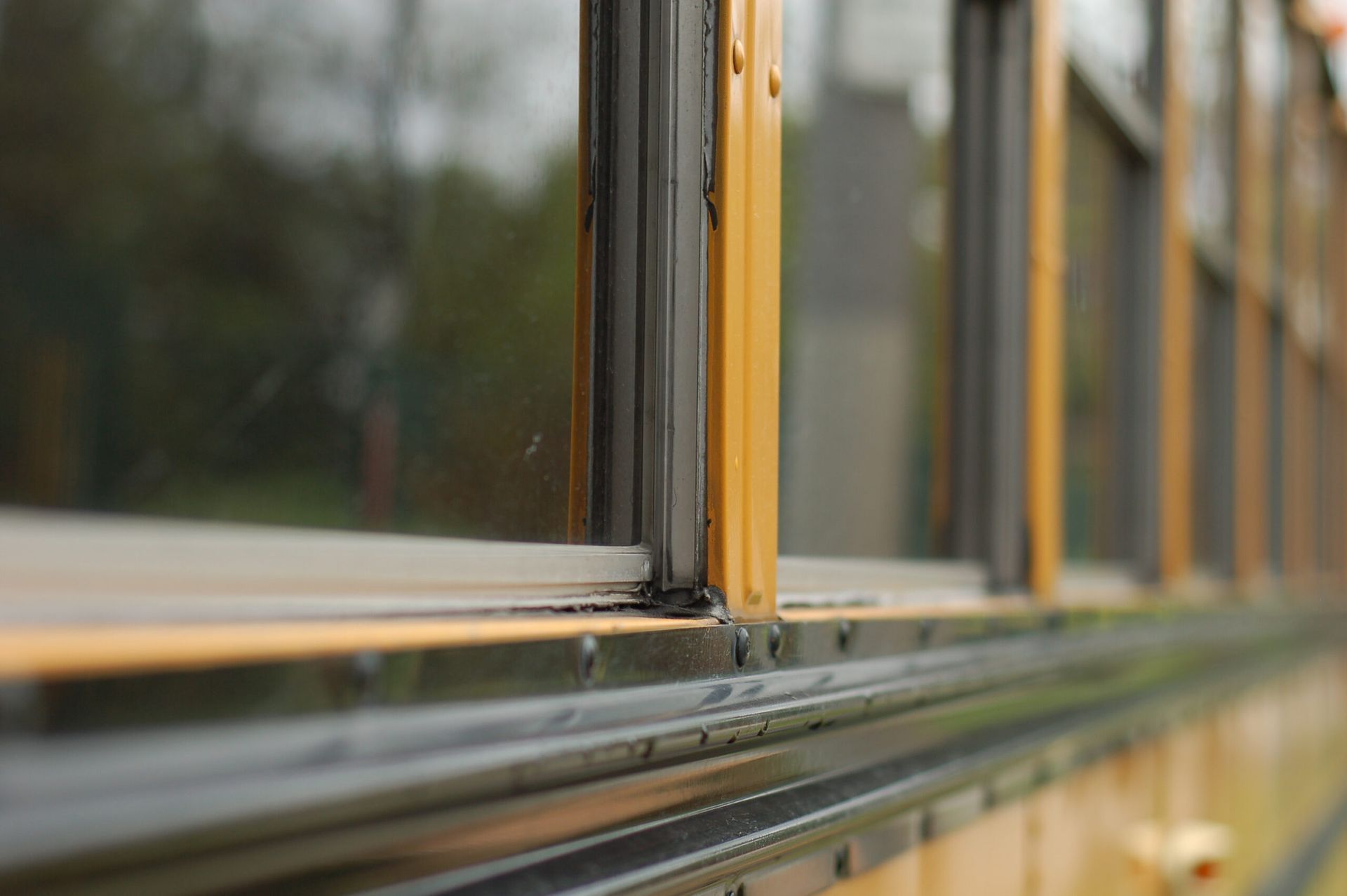 A close up of a window on a school bus.