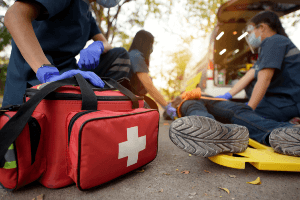 Emergency Medical Technicians treating accident victim 
