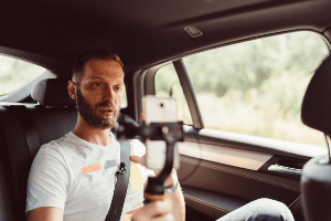 Man filming himself in a car