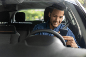 man texting and driving