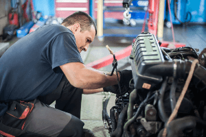 mechanic fixing vehicle