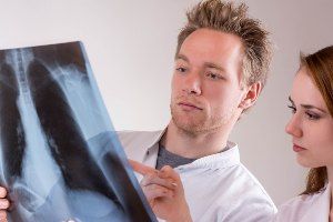 doctors reviewing chest x-ray