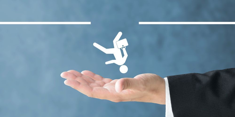 A hand catches a falling stick figure, bridging a gap between white lines, against a blue background.