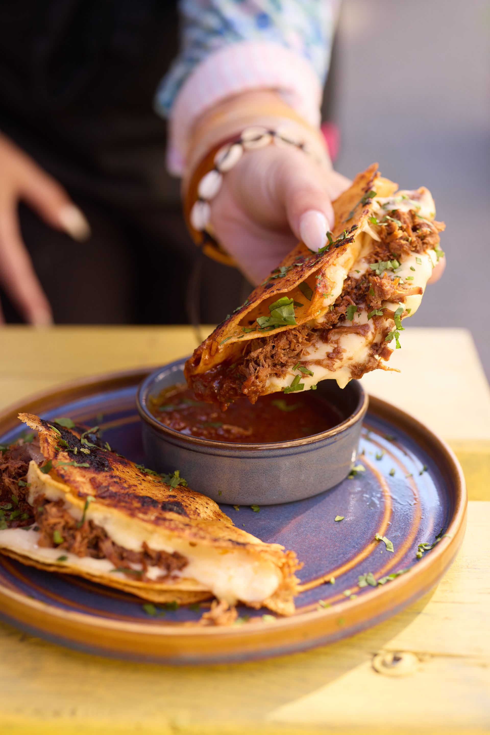 A group of people are sitting at a table with drinks.