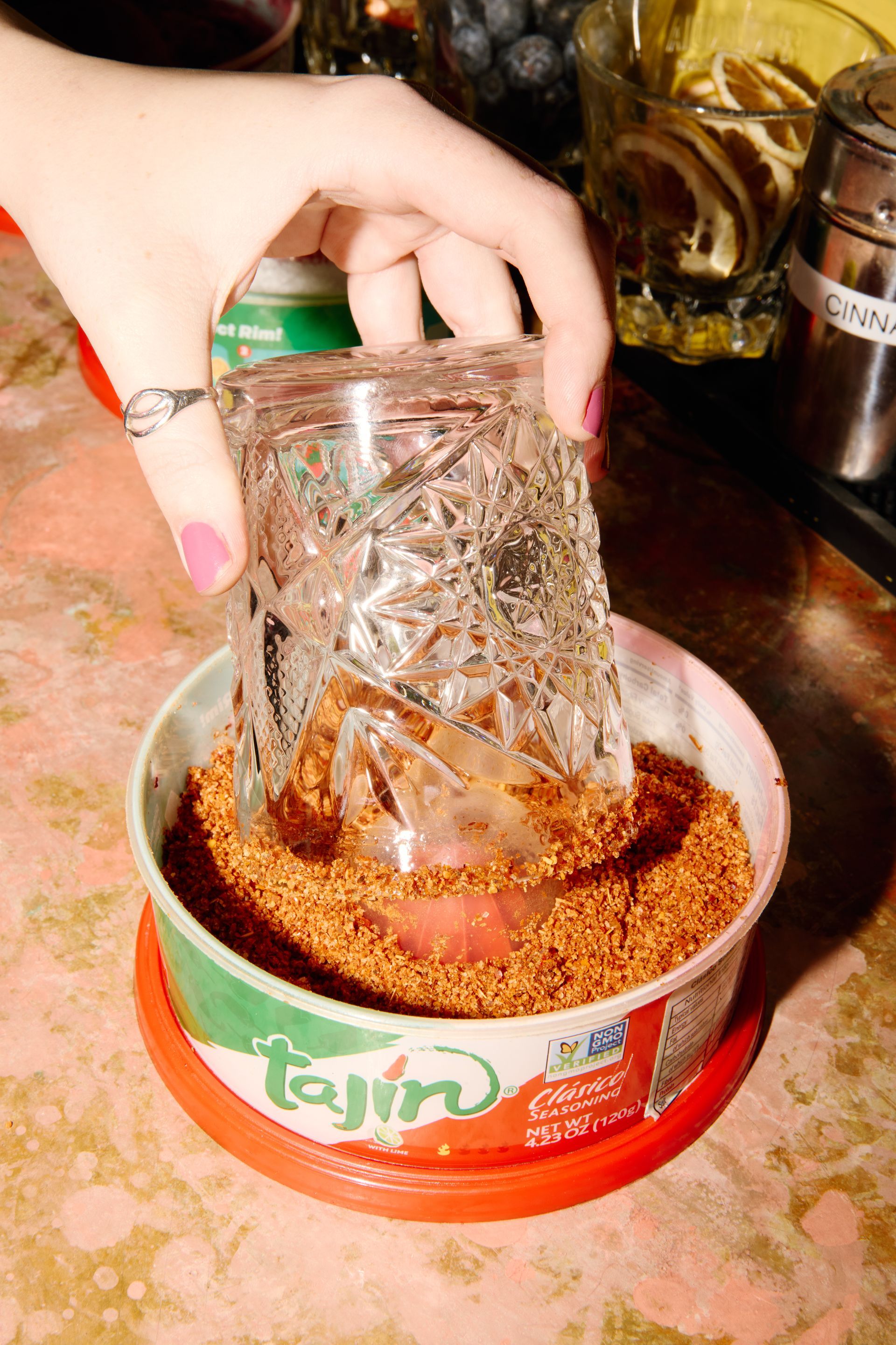 A table topped with plates of food and a glass of margarita.