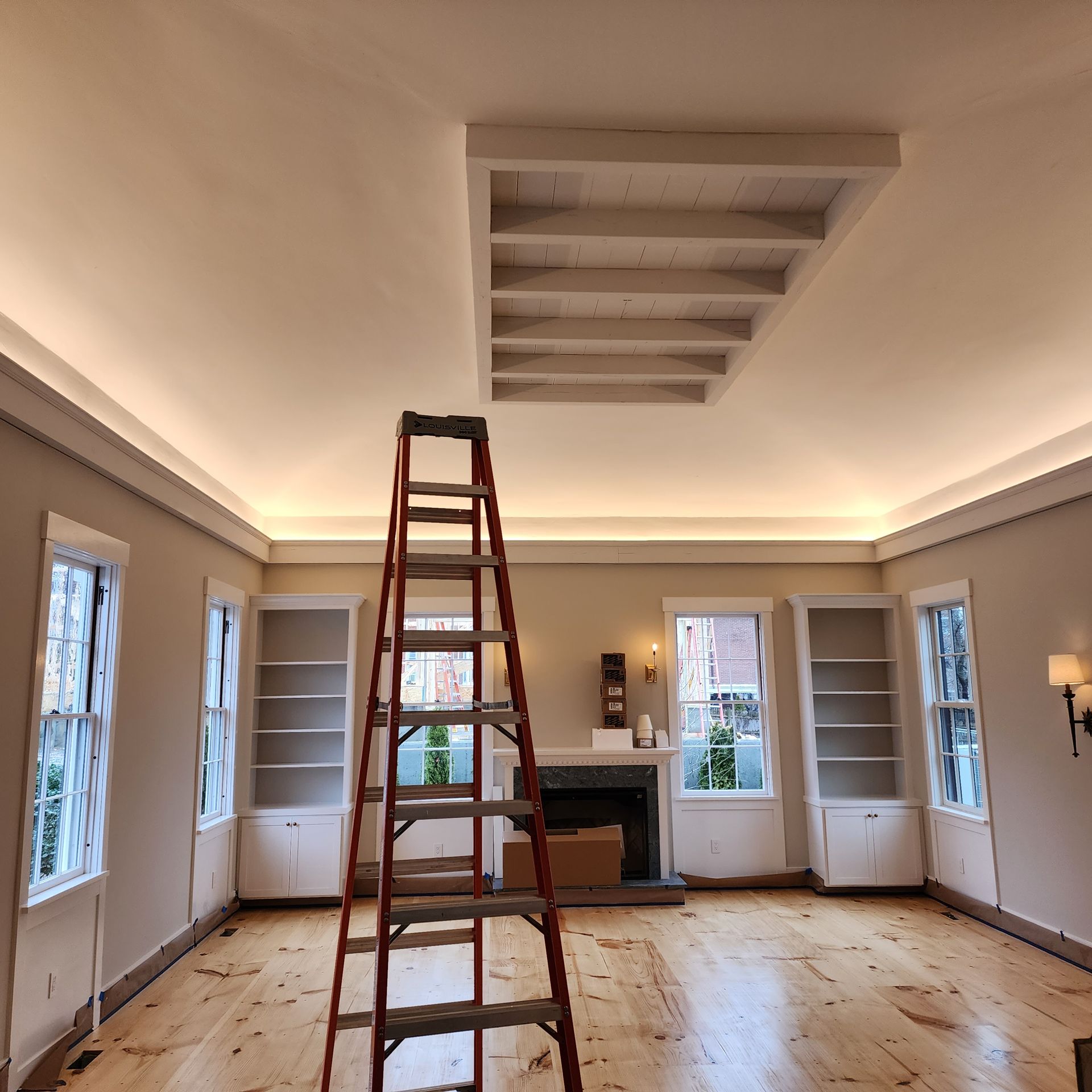 A room with a ladder in the middle of it