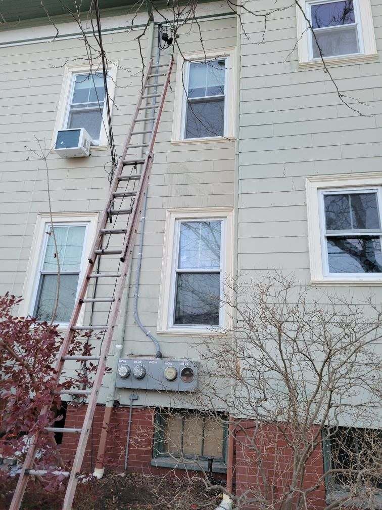 A ladder is attached to the side of a building.