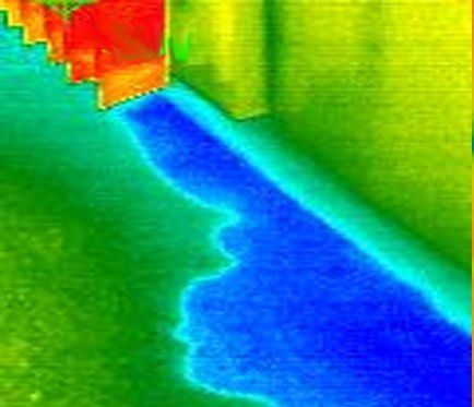 A thermal image of a staircase with a blue shadow on the floor.
